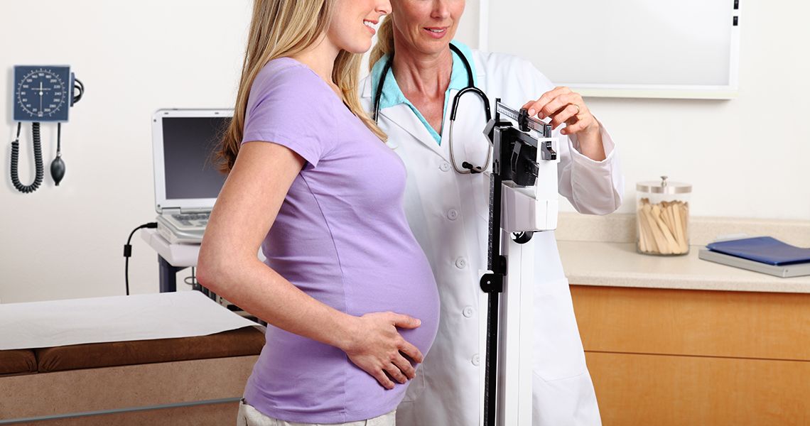 Pregnant patient with doctor