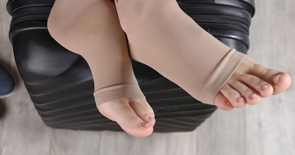 Feet wrapped in a compression sleeve